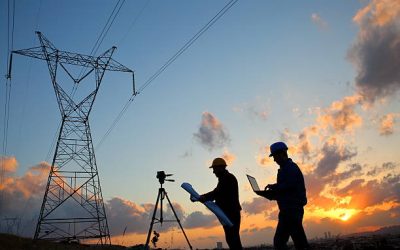 Silhouette of engineers workers at electricity station.